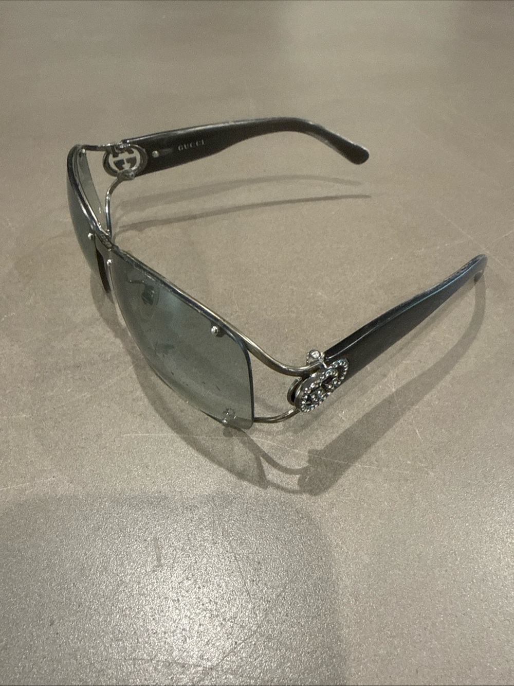 Gucci Women's Black Frame Sunglasses with Gray Lenses and Silver Accents